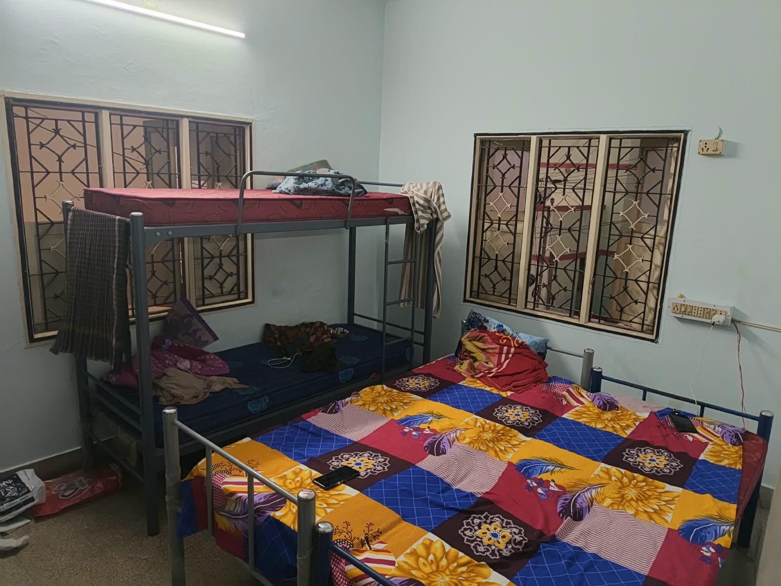 Room with a bunk bed and a double bed at Shree Sai Vishnu PG for Men, East Tambaram